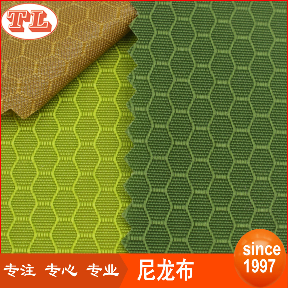 现货供应210D六角蜂巢格PU防泼水尼龙面料高档手袋箱包布料