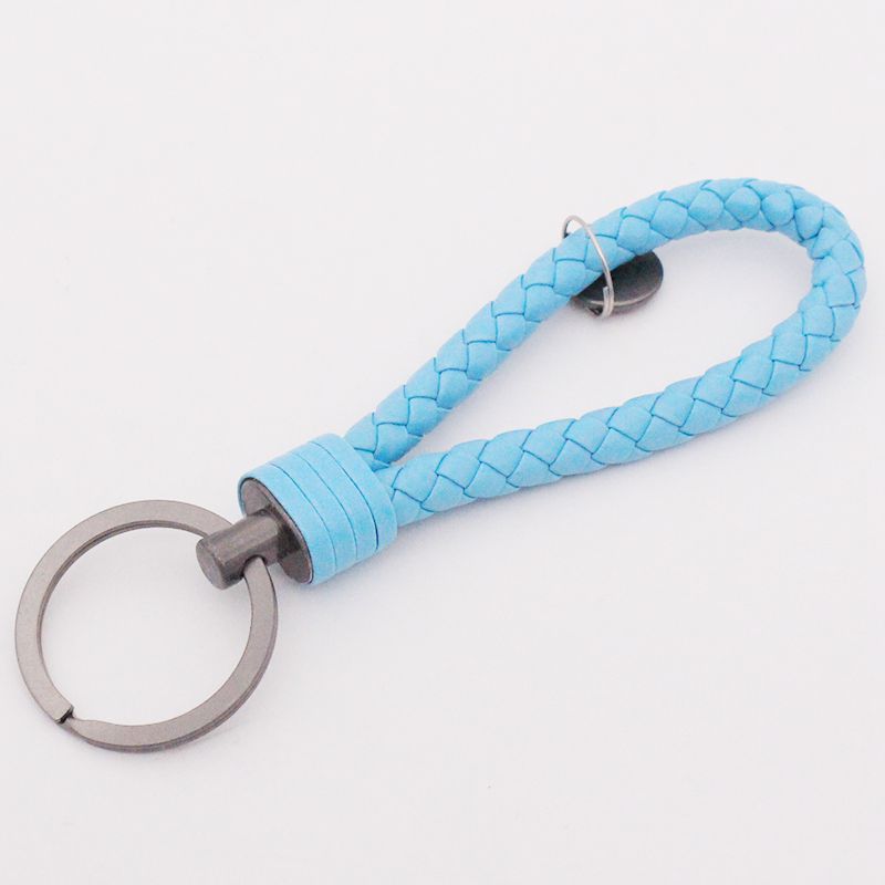 Llavero de acero de tungsteno para hombres y mujeres llavero de coche cuerda de cuero tejida hecha a mano par llavero colgante letras