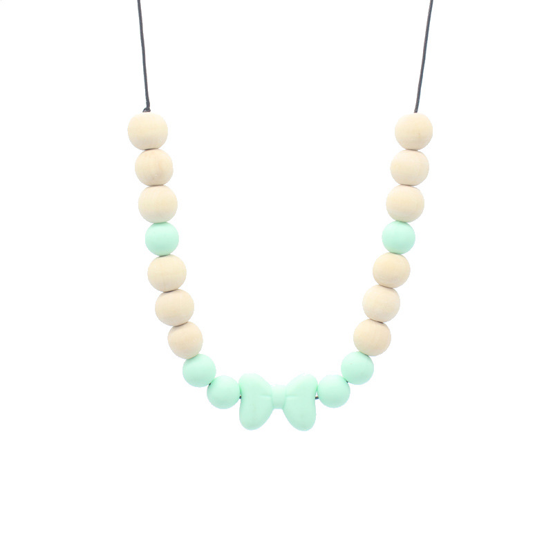 Bebé arco mordedor collar bebé joyería de los niños mordedor palo de silicona collar de cuentas de madera mordida colgante de pegamento