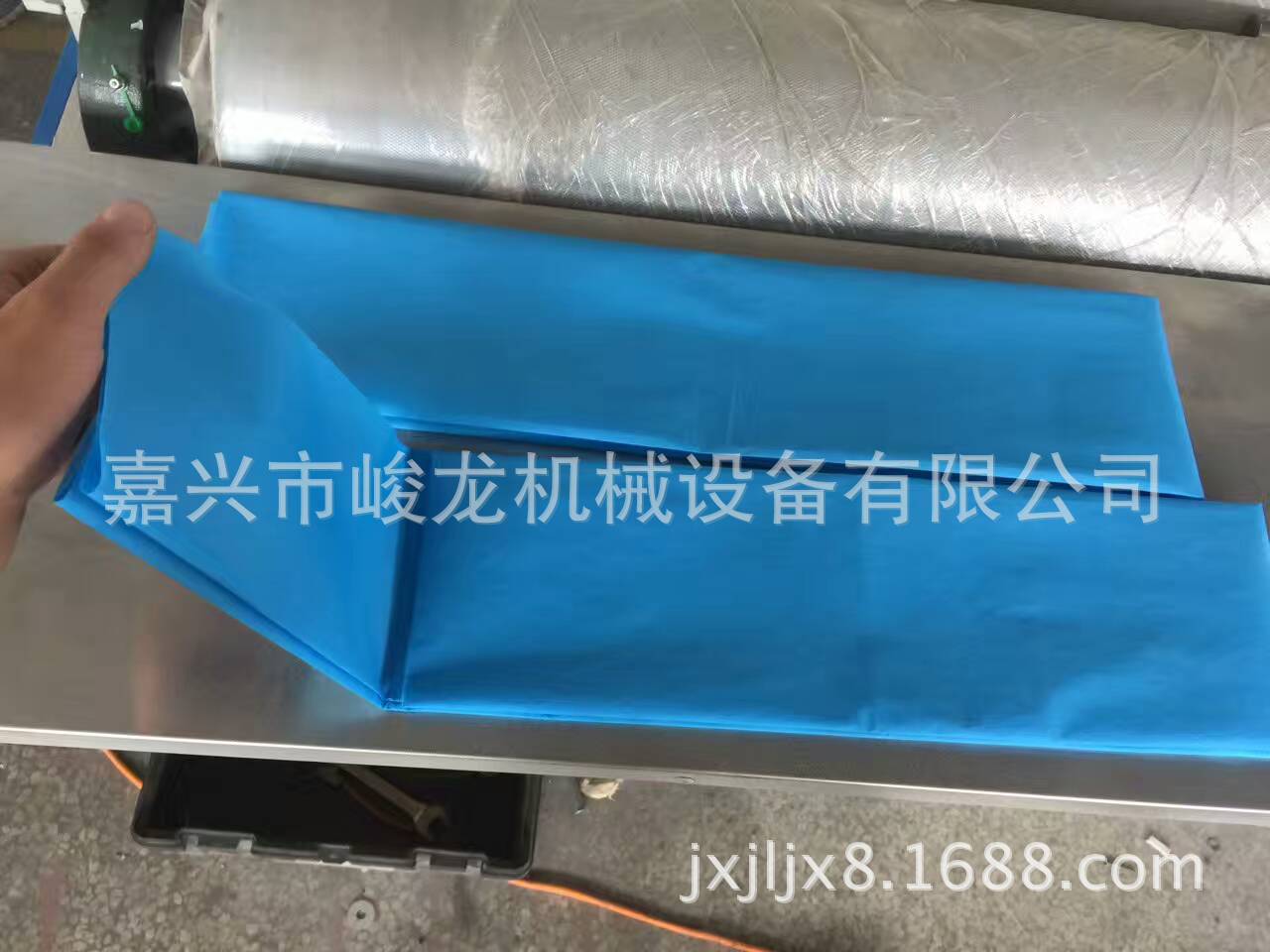 1厂家直销一次性床单机器设备 美容太阳孔床单折叠机 无纺布床单