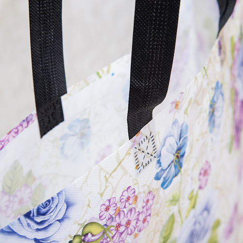 Manufacturer color printing coated non-woven hand-held shopping bag non-woven clothing advertising packaging bag blue and white porcelain