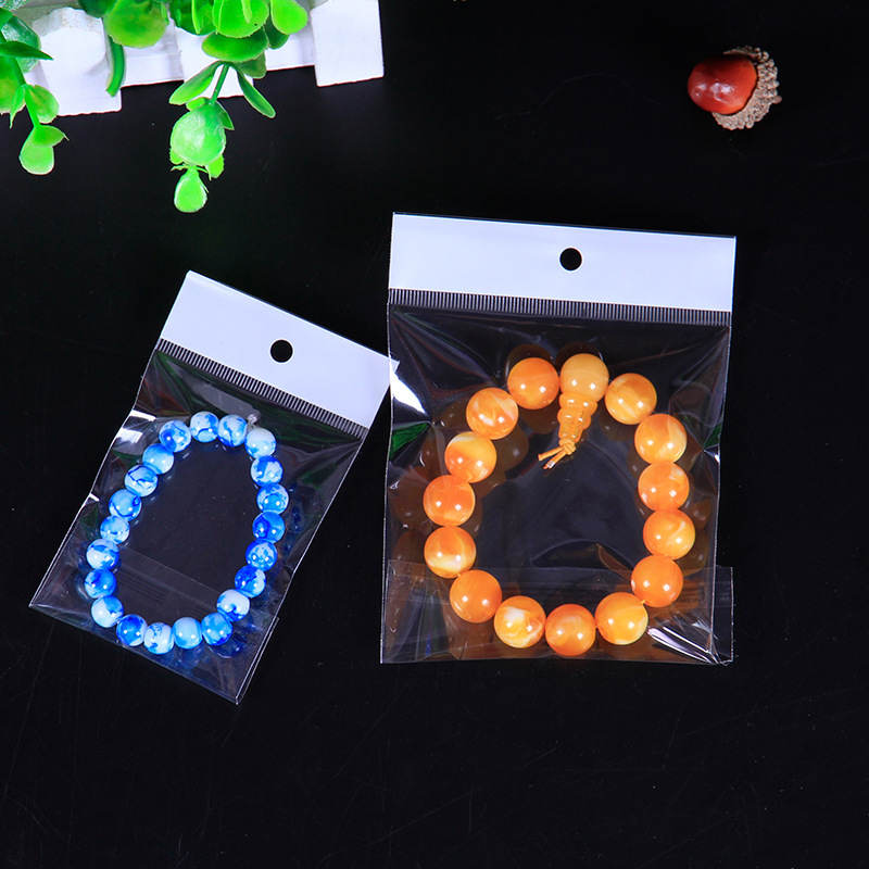 OPP白色卡头袋印花不干胶自粘袋子吊孔袋图案玩具包装袋批发销售