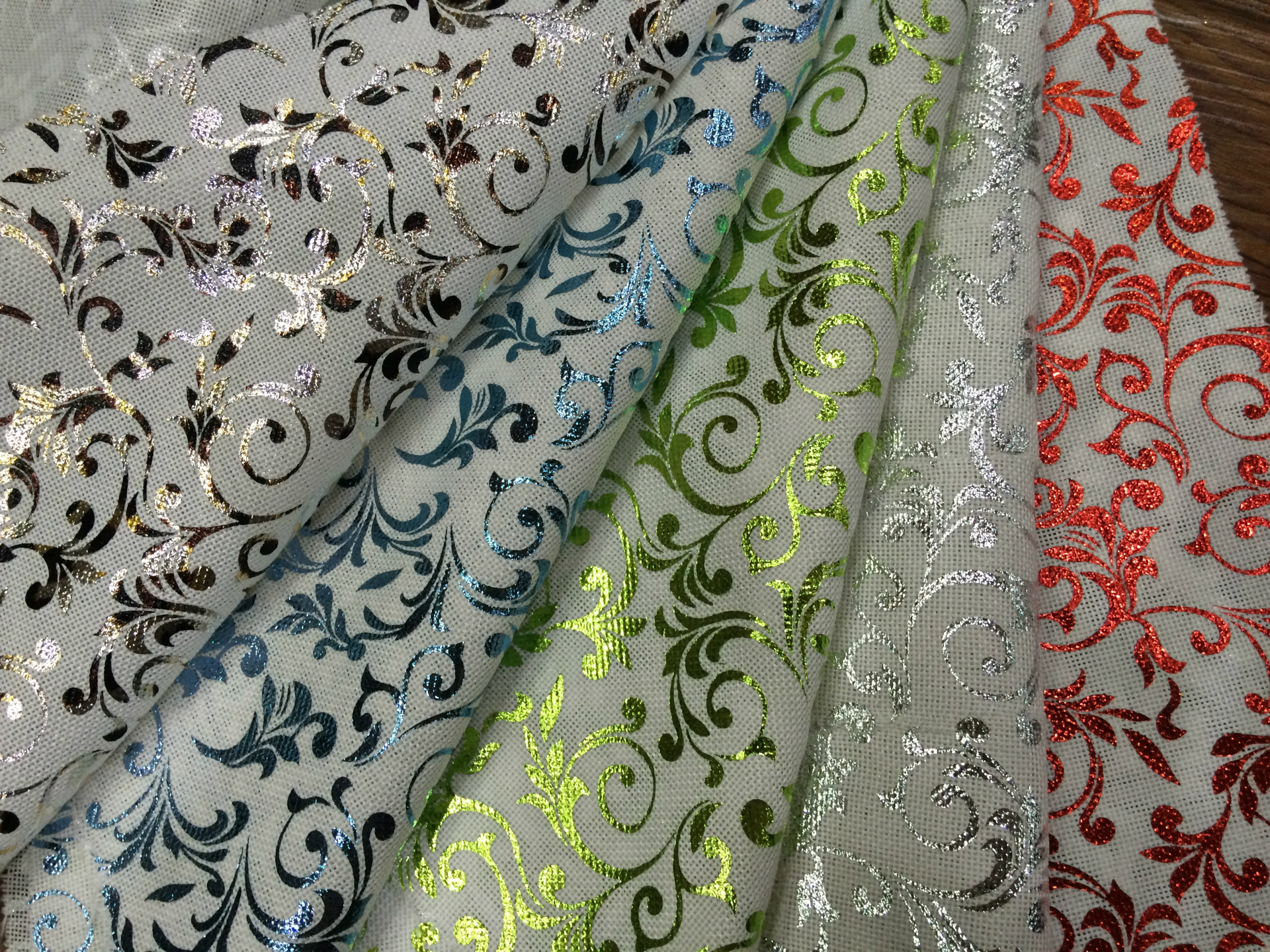 盛荣工厂直销烫金花型仿麻150gsm圣诞装饰布多种颜色可选质量保证