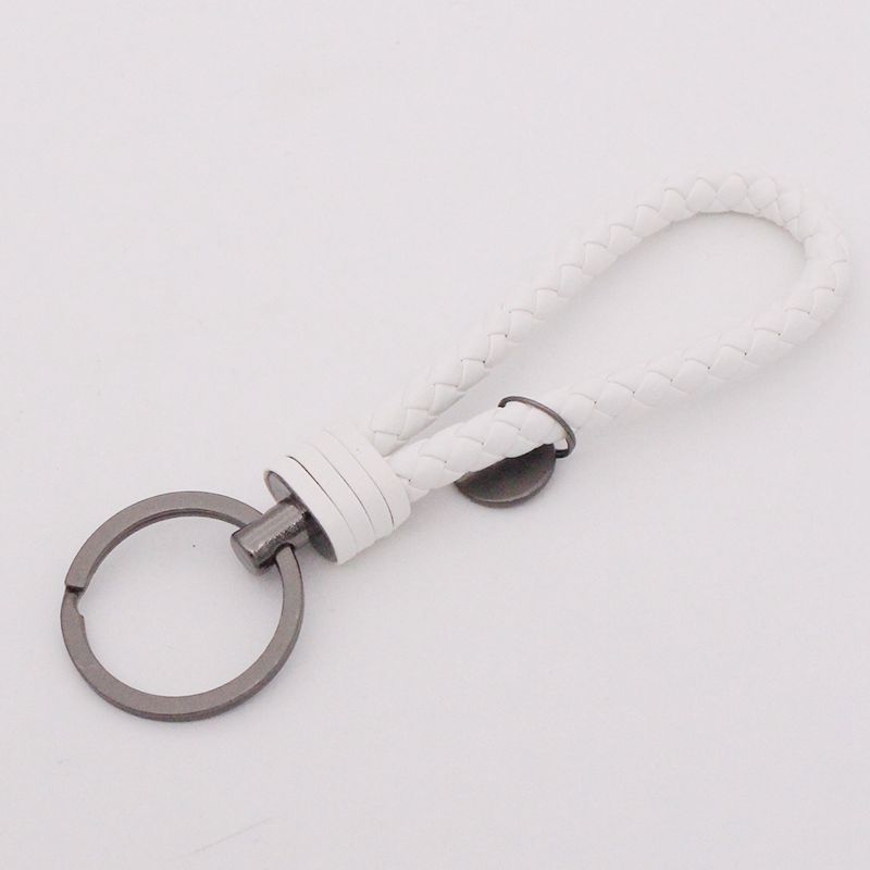 Llavero de acero de tungsteno para hombres y mujeres llavero de coche cuerda de cuero tejida hecha a mano par llavero colgante letras