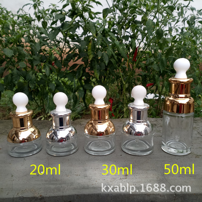 Venta al por mayor de fábrica 30ml 50ml botella de aceite esencial de vidrio transparente botella cuentagotas cosmética botella vacía botella