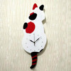 Factory wholesale creative cartoon wall clock will move the tail of the tail of the cat's cat hanging clock, the living room is simple