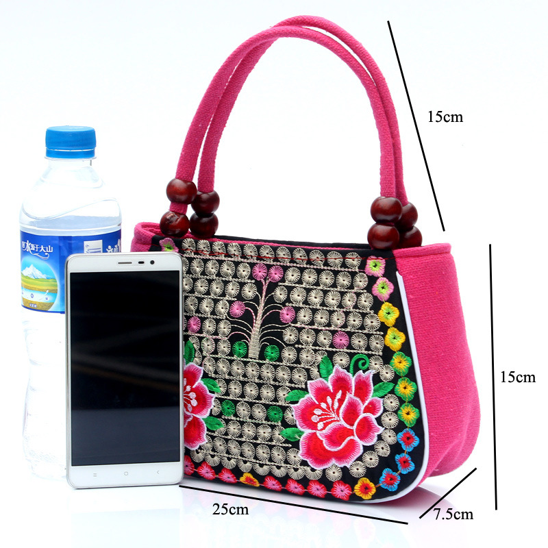 Directo de fábrica nuevo estilo étnico bordado bolsa cobre moneda flor pequeño bolso Yunnan bordado bolso especial Miao bordado bolsa