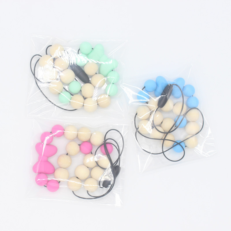 Bebé arco mordedor collar bebé joyería de los niños mordedor palo de silicona collar de cuentas de madera mordida colgante de pegamento