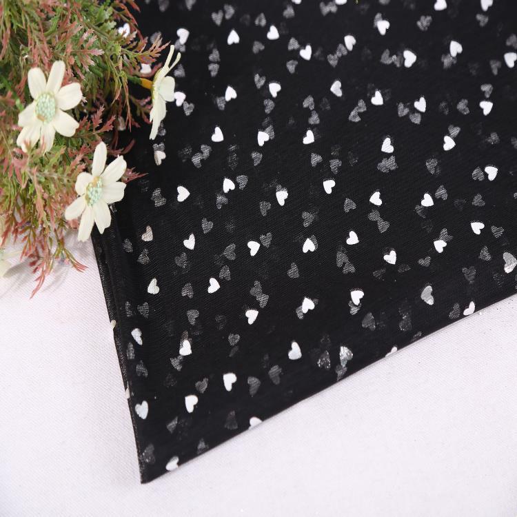 Fabricante de suministro de tela de malla hexagonal tela de malla de amor estampado ropa de rendimiento ropa de mujer ropa de niños tela de decoración