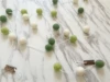 Wool ball sibling: white+dark green+light green