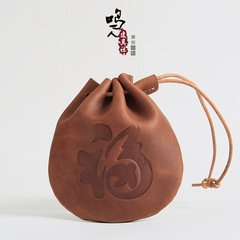 Factory-direct top-layer cowhide drawstring coin purse for men, genuine leather coin holder, and women's storage bag with adjustable drawstring.