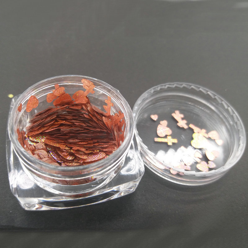 Wholesale heart and cross nail art supplies, star-shaped laser heart and cross nail art glitter sets.