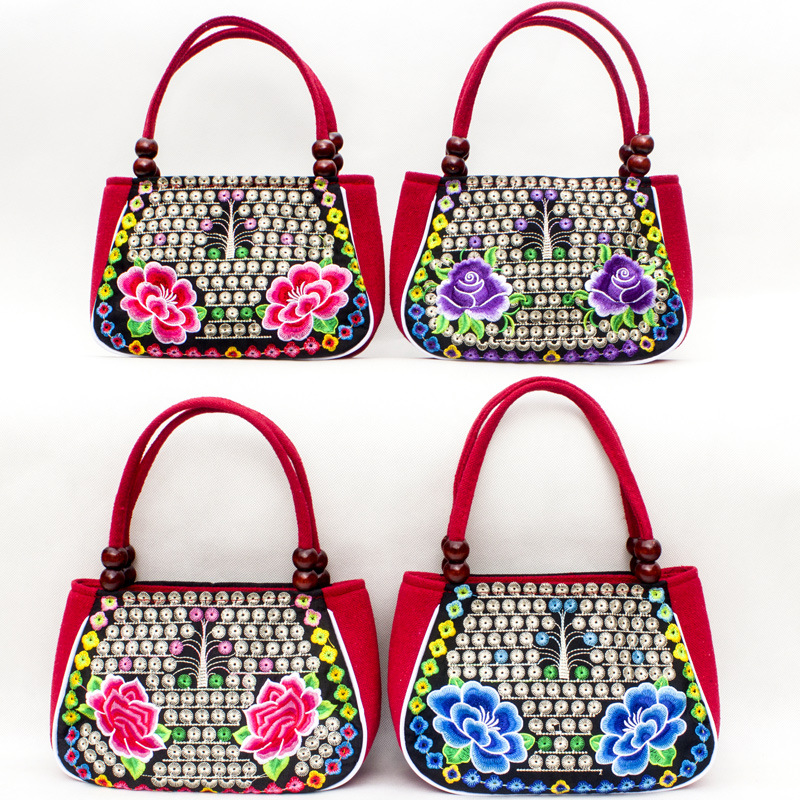 Directo de fábrica nuevo estilo étnico bordado bolsa cobre moneda flor pequeño bolso Yunnan bordado bolso especial Miao bordado bolsa