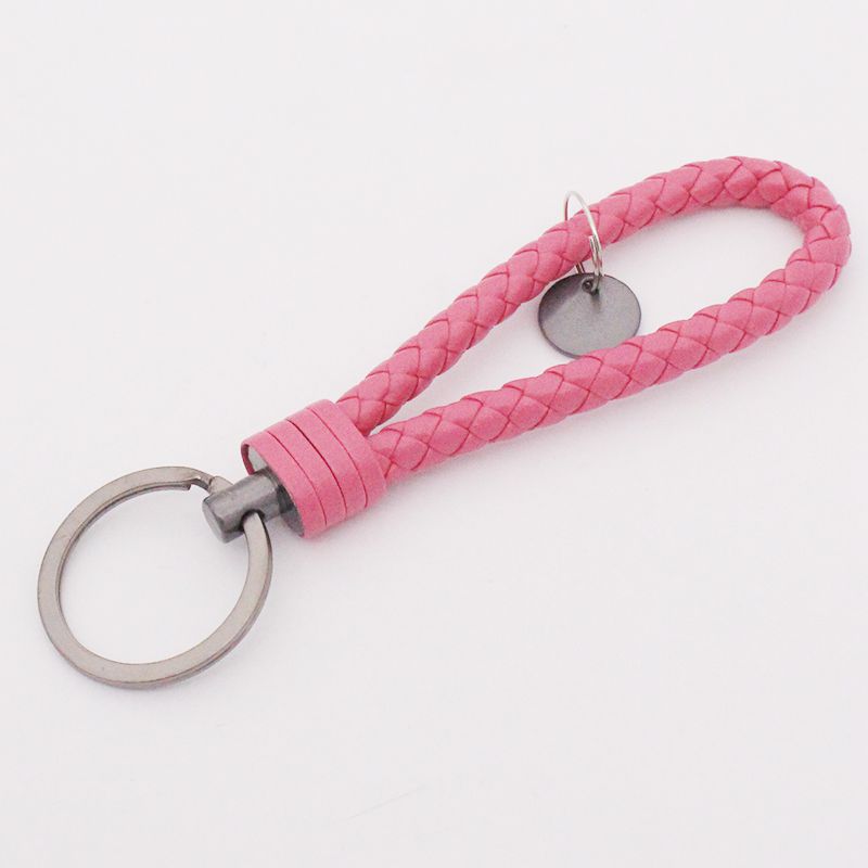Llavero de acero de tungsteno para hombres y mujeres llavero de coche cuerda de cuero tejida hecha a mano par llavero colgante letras