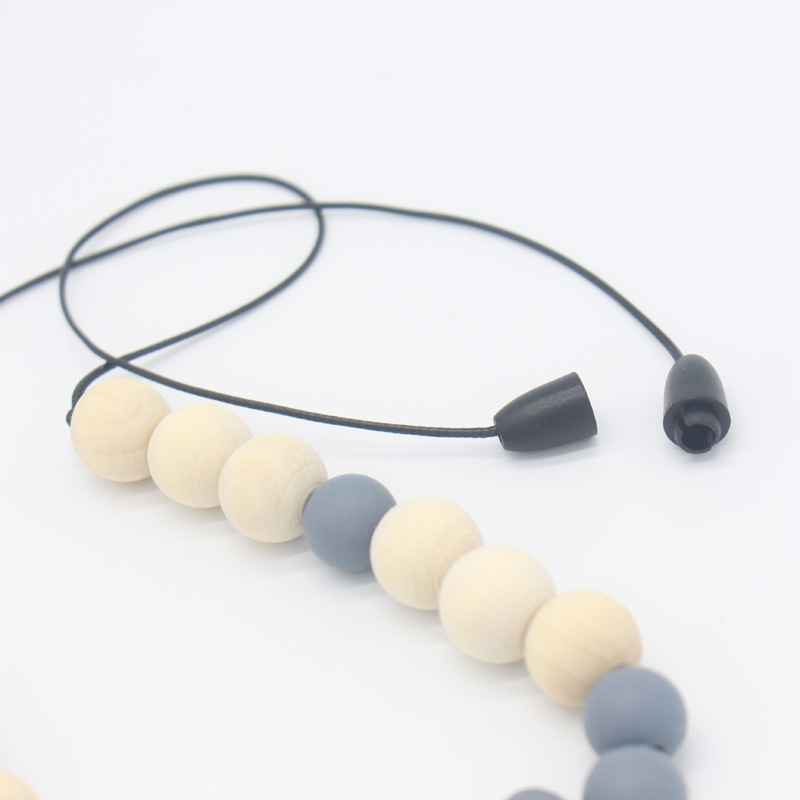 Bebé arco mordedor collar bebé joyería de los niños mordedor palo de silicona collar de cuentas de madera mordida colgante de pegamento