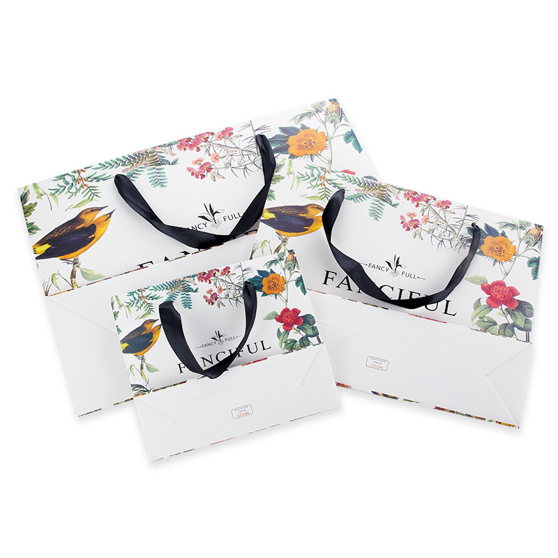 Ropa bolsa de regalo bolso bolsa de papel creativo retro exquisito bolso de compras impreso logo bolsa de regalo