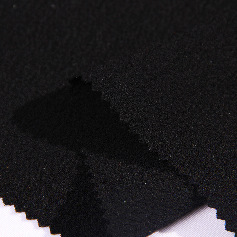 【新品】全涤乱麻四面弹 时尚女装阔腿裤服装面料  黑色乱麻布料