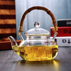 Wholesale high temperature resistant glass high transparency bamboo handle glass Pu'er flower teapot kettle handle teapot bamboo handle thickened teapot