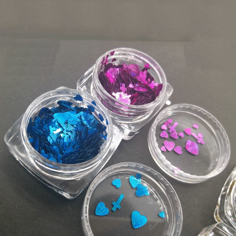 Wholesale heart and cross nail art supplies; star-shaped laser heart and cross nail art glitter, kilogram pack.