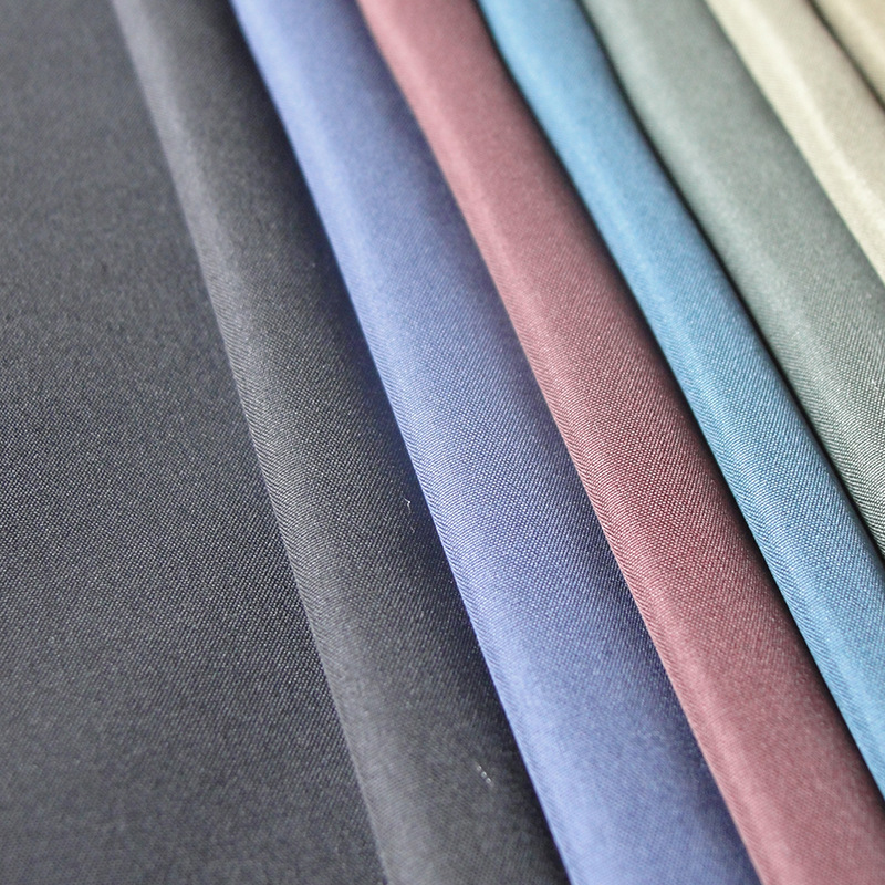 厂家批发210T涤丝纺涤塔夫里布经典平缸染色春夏服装大衣里料
