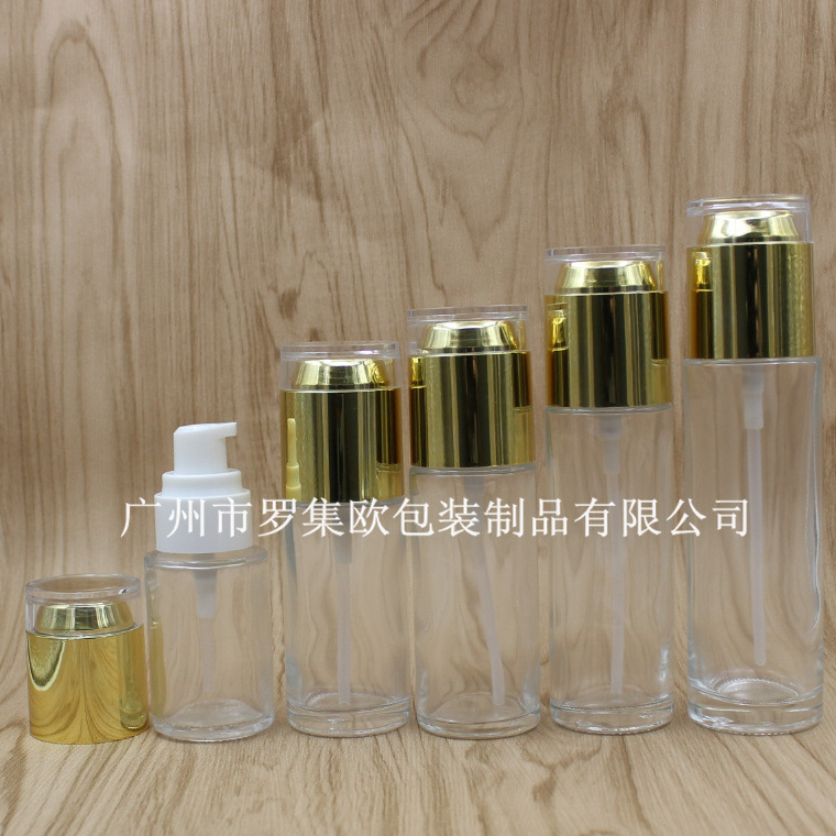现货高档透明乳液玻璃瓶按压精华液瓶爽肤水分装空瓶亮金亚克力盖