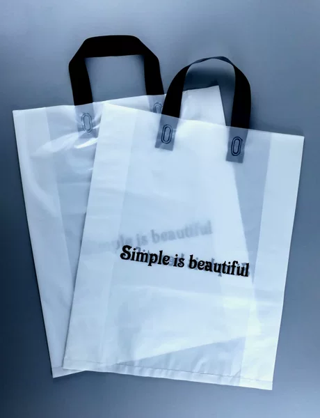 Custom plastic tote bag clothing shopping bag PE hand bow bag