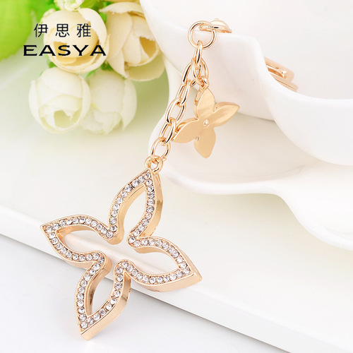 Yiwu small jewelry Korean version creative four-leaf clover car keychain pendant fashionable and exquisite women's bag pendant wholesale