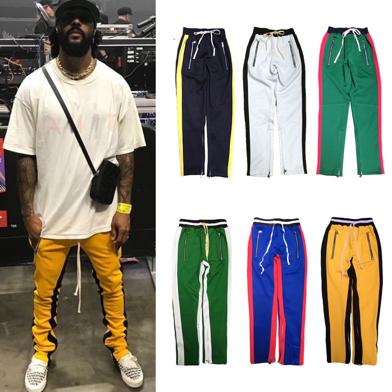 men's green track pants with red stripe