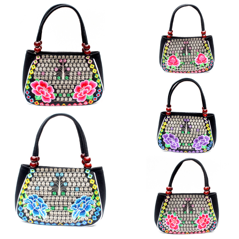 Directo de fábrica nuevo estilo étnico bordado bolsa cobre moneda flor pequeño bolso Yunnan bordado bolso especial Miao bordado bolsa