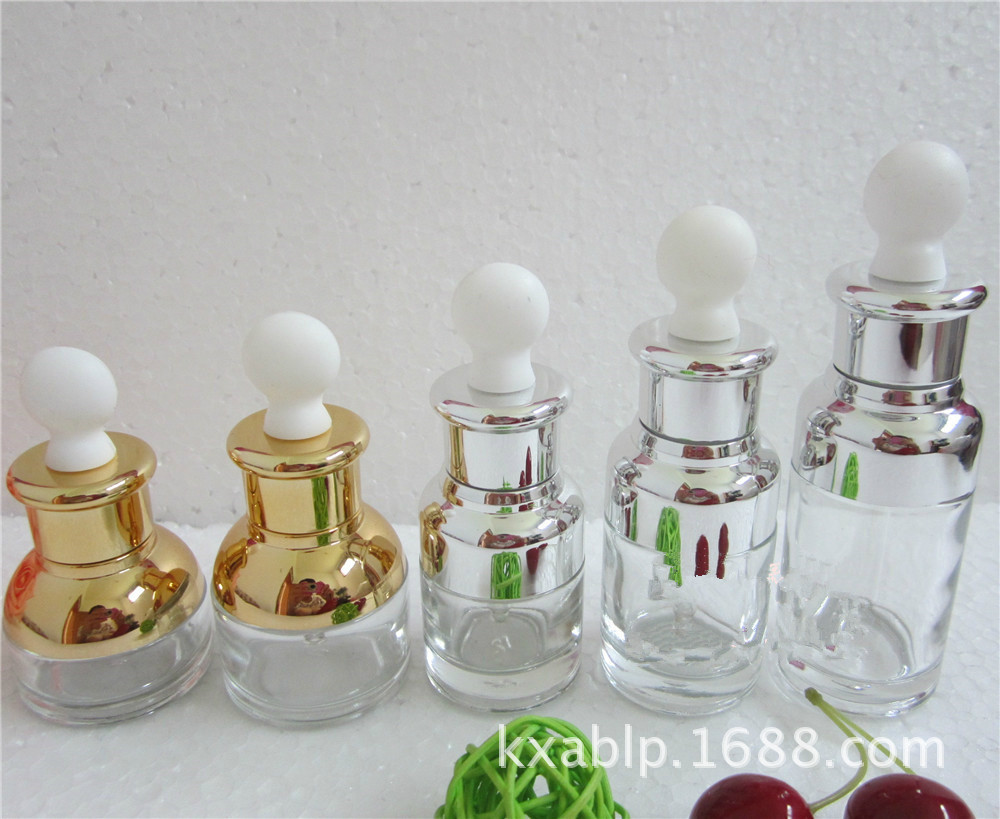 Venta al por mayor de fábrica 30ml 50ml botella de aceite esencial de vidrio transparente botella cuentagotas cosmética botella vacía botella