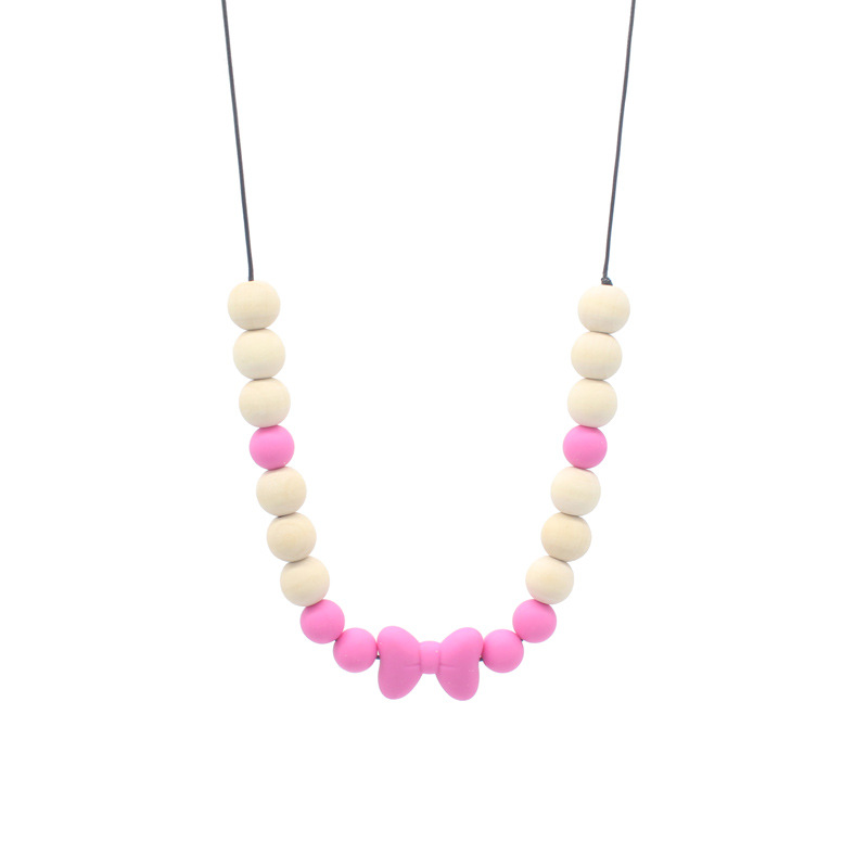 Bebé arco mordedor collar bebé joyería de los niños mordedor palo de silicona collar de cuentas de madera mordida colgante de pegamento
