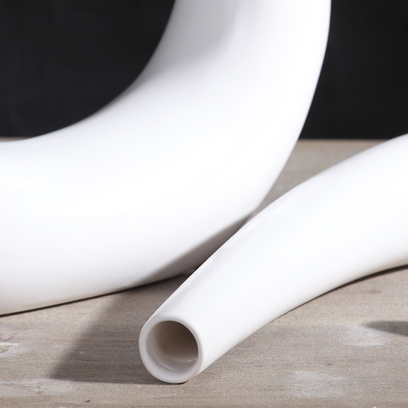 Decoración del hogar sala de estar decoración creativa blanco simple moderna TV gabinete decoración botella curvada artesanía al por mayor