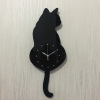 Factory wholesale creative cartoon wall clock will move the tail of the tail of the cat's cat hanging clock, the living room is simple