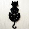 Factory wholesale creative cartoon wall clock will move the tail of the tail of the cat's cat hanging clock, the living room is simple