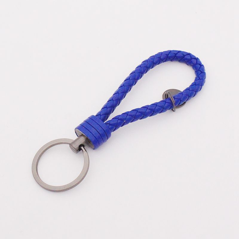 Llavero de acero de tungsteno para hombres y mujeres llavero de coche cuerda de cuero tejida hecha a mano par llavero colgante letras