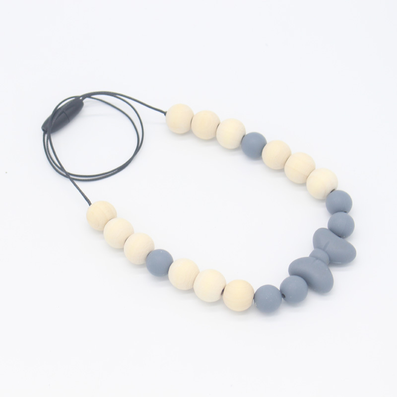 Bebé arco mordedor collar bebé joyería de los niños mordedor palo de silicona collar de cuentas de madera mordida colgante de pegamento
