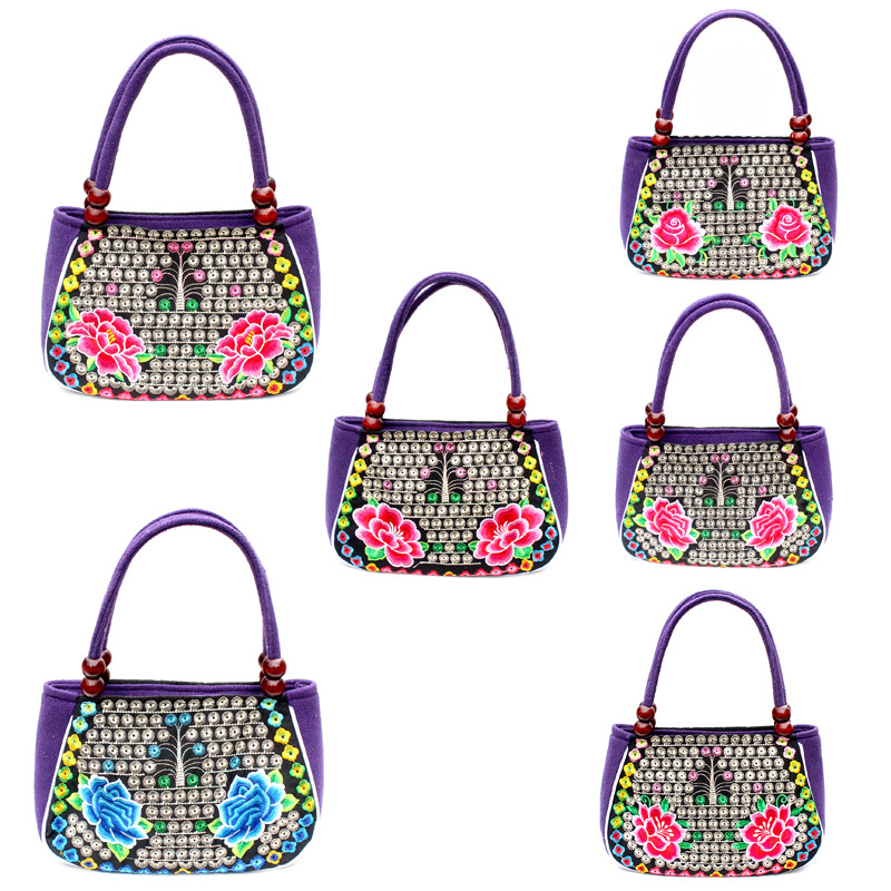 Directo de fábrica nuevo estilo étnico bordado bolsa cobre moneda flor pequeño bolso Yunnan bordado bolso especial Miao bordado bolsa