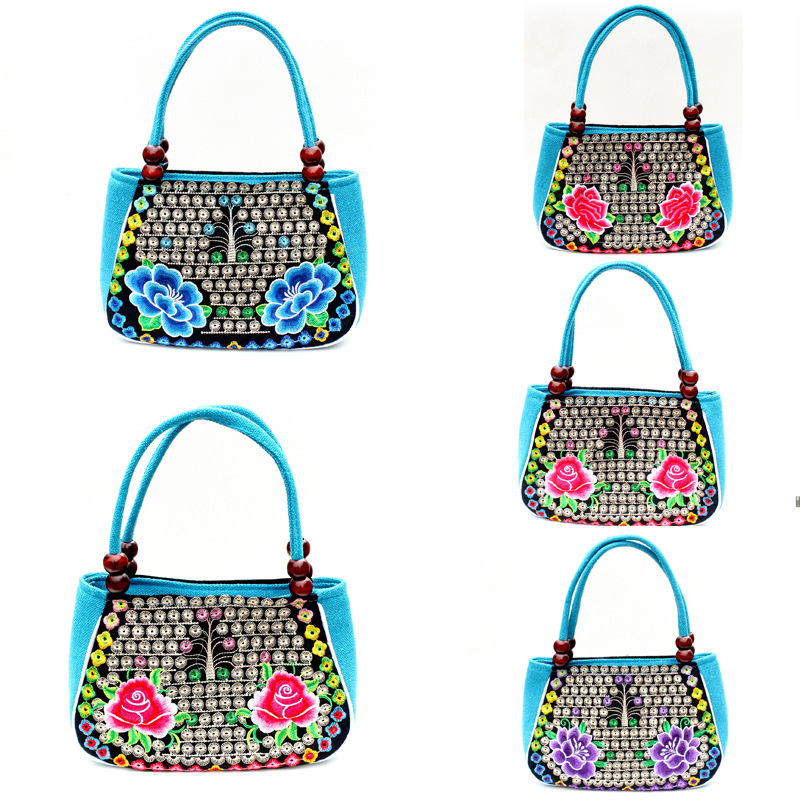 Directo de fábrica nuevo estilo étnico bordado bolsa cobre moneda flor pequeño bolso Yunnan bordado bolso especial Miao bordado bolsa