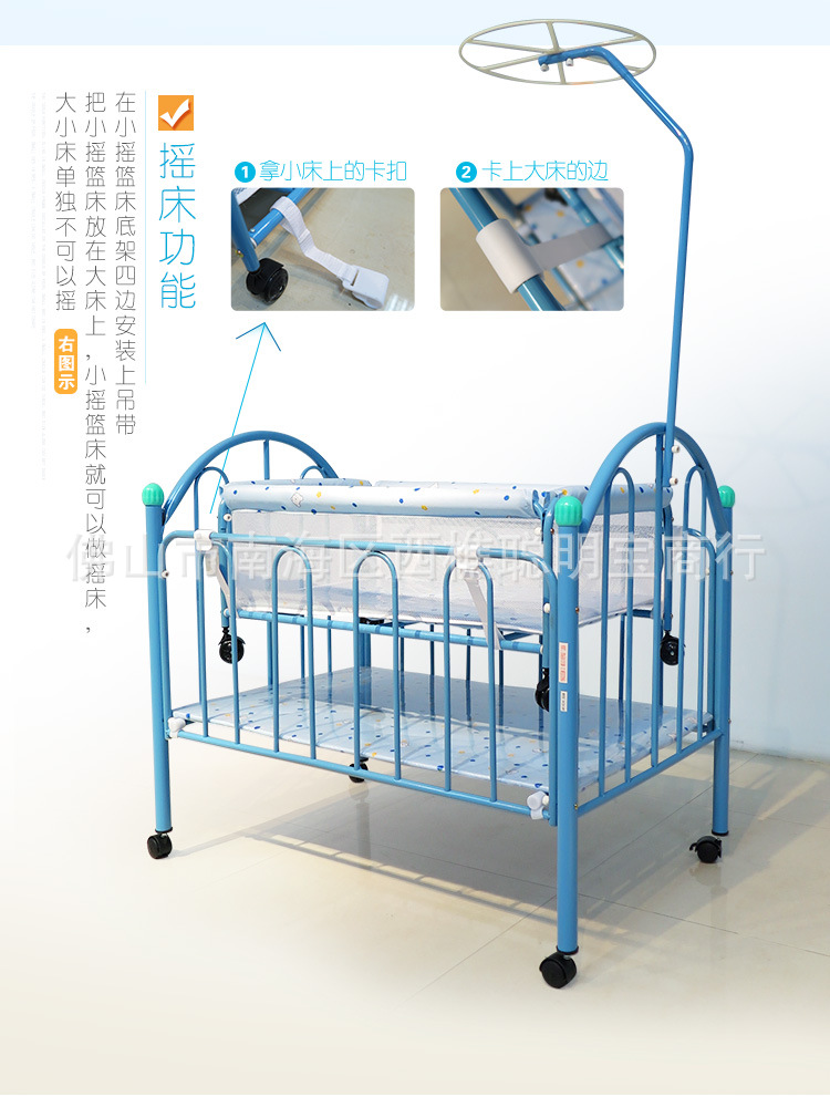 Cuna mecedora infantil con ruedas y mosquitera