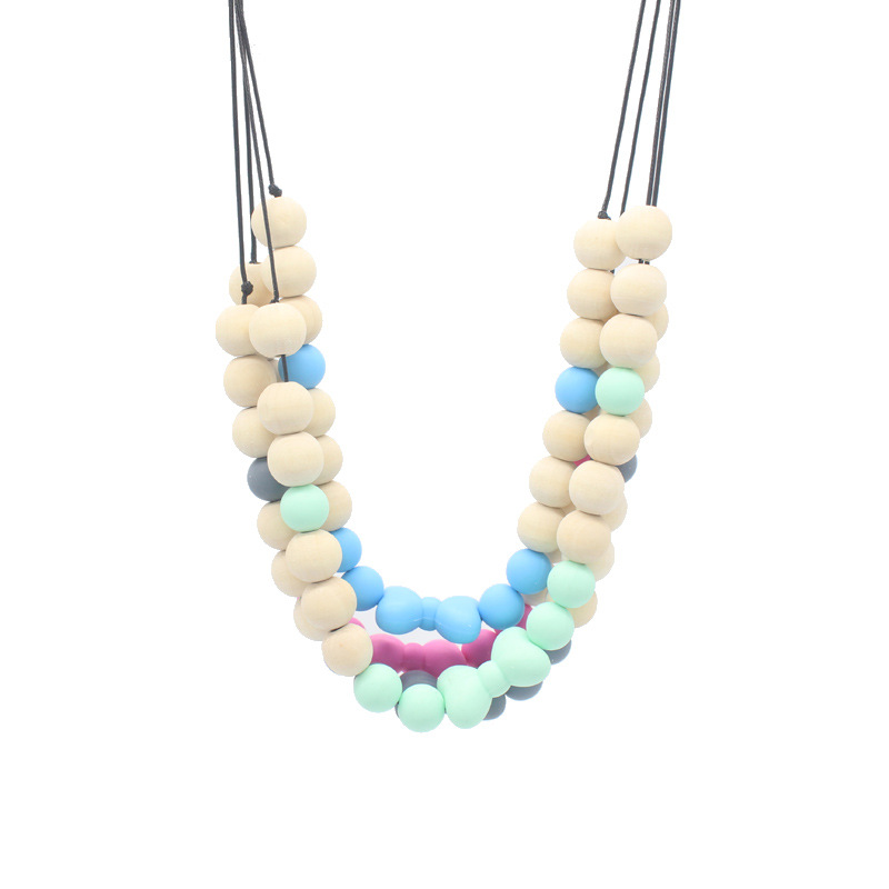 Bebé arco mordedor collar bebé joyería de los niños mordedor palo de silicona collar de cuentas de madera mordida colgante de pegamento