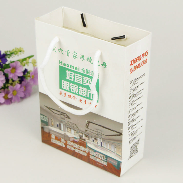 厂家定做服装手提纸袋 眼镜纸袋个性礼品包装纸袋加印LOGO购物袋