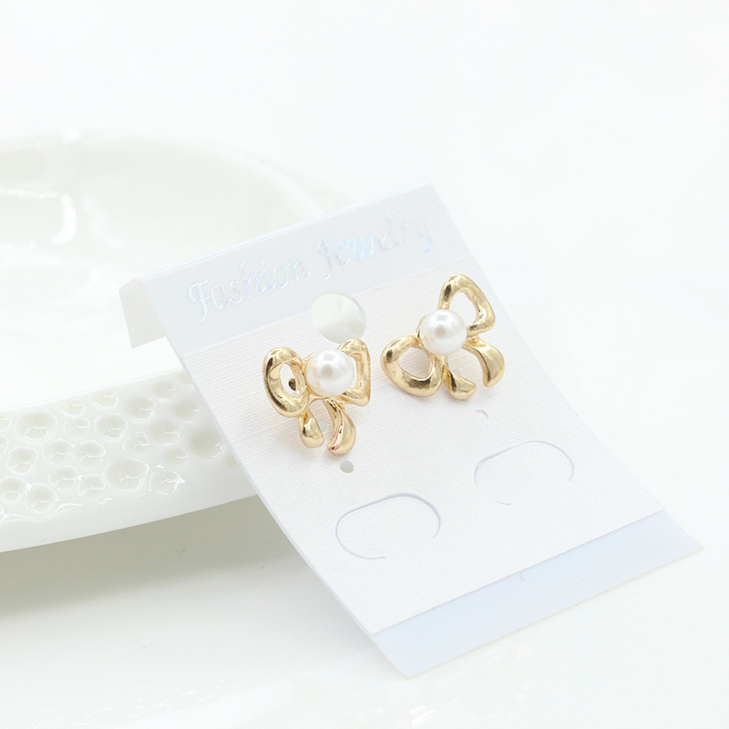 Simple Bow Earrings Gold-plated Silver Inlaid Pearl Earrings 8-shaped Bow Tie Earrings Wholesale display picture 7