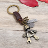 Leather keychain with zipper, metal robot, fashionable accessory, Korean style, genuine leather, wholesale