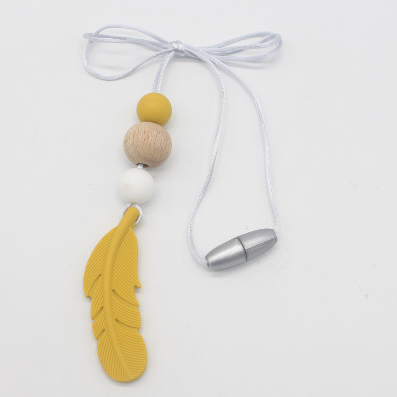 Amazon nueva pluma mordedor collar bebé calmante molar silicona seguridad ambiental Beech bead collar