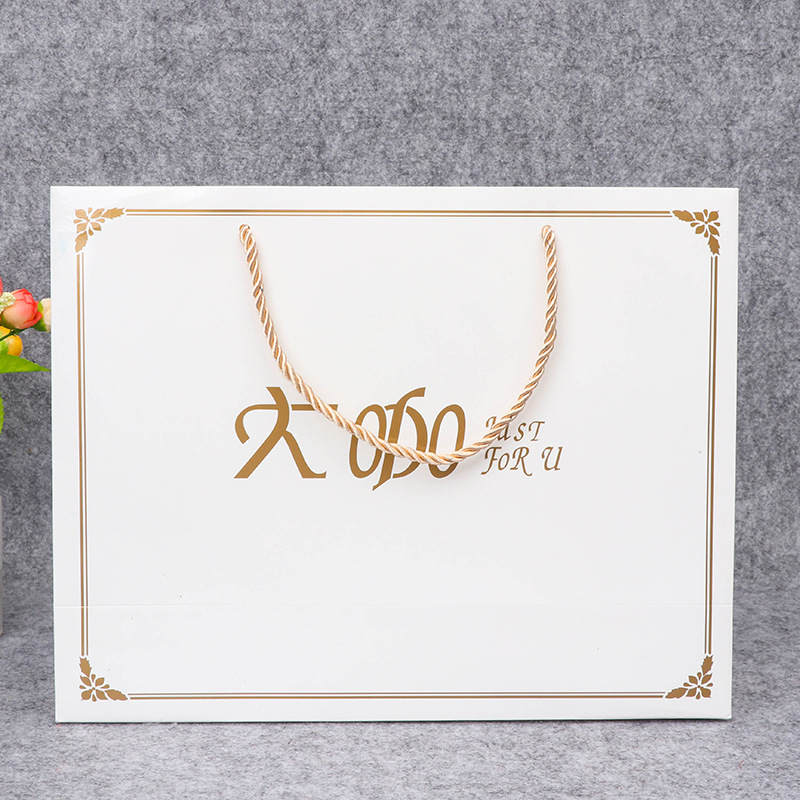 印字手提袋 纸质包装袋伴手礼服装购物白卡纸袋现货加印LOGO