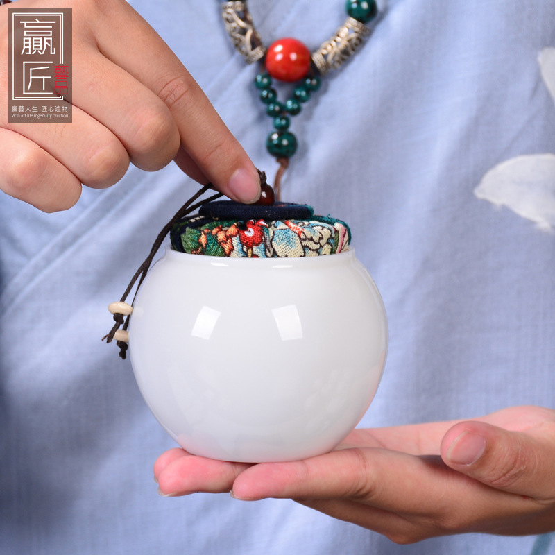 Winjiang blanco porcelana sellada tarro de té Corcho de cerámica sellado tarro pequeño tamaño Pu'er almacén de té ovejas grasa Jade porcelana tarro de té