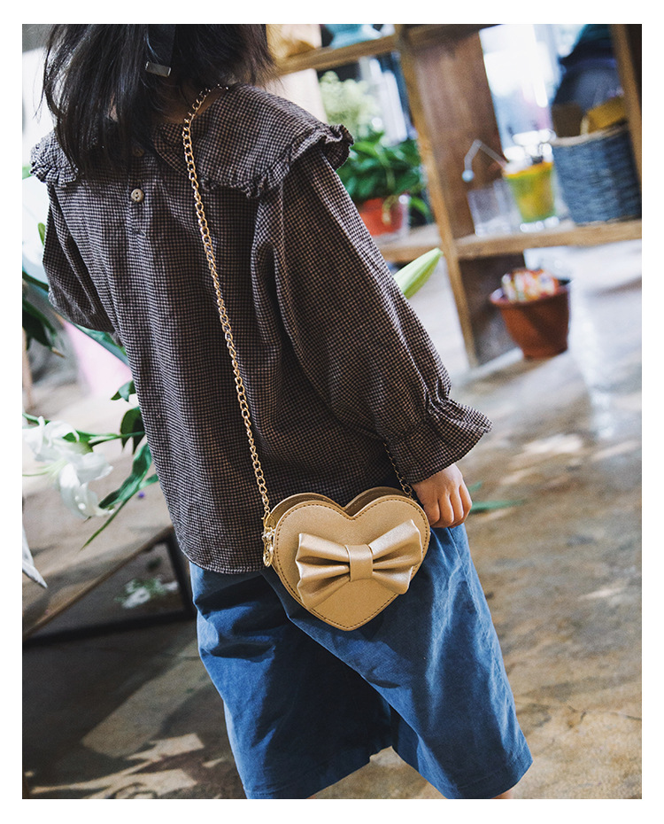 Unisex Small Pu Leather Solid Color Bow Knot Cute Heart-shaped Zipper Crossbody Bag display picture 23