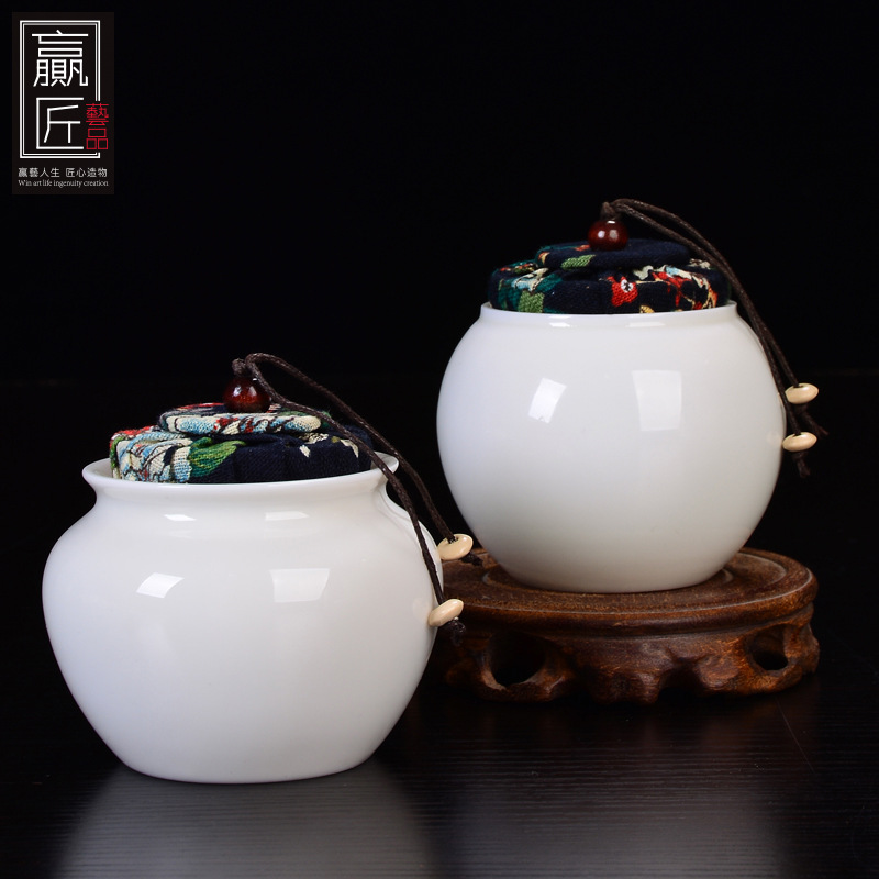 Winjiang blanco porcelana sellada tarro de té Corcho de cerámica sellado tarro pequeño tamaño Pu'er almacén de té ovejas grasa Jade porcelana tarro de té