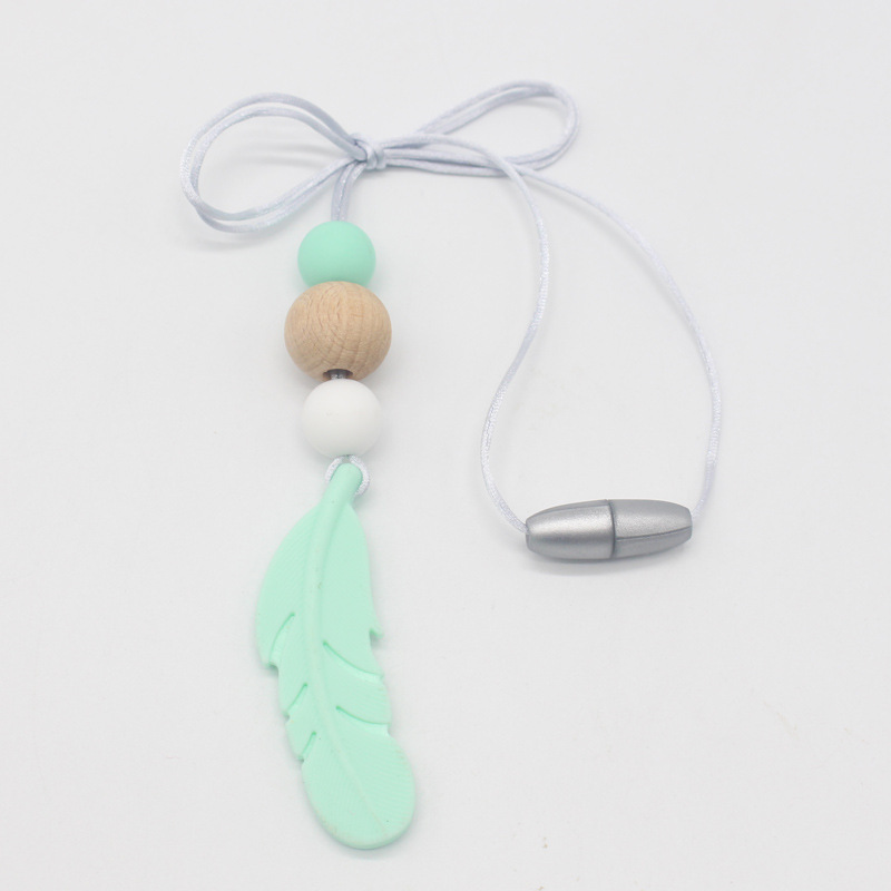 Amazon nueva pluma mordedor collar bebé calmante molar silicona seguridad ambiental Beech bead collar