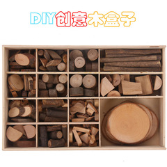 Wooden gift box packaging for kindergarten low-structure area activity materials, including wood pieces, tree leaves, and dry branches.